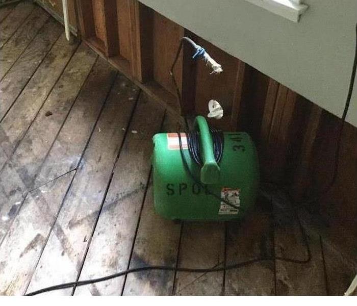 wood floor with SERVPRO air mover
