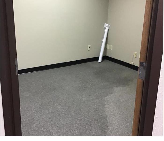 water soaked carpet in a commercial office