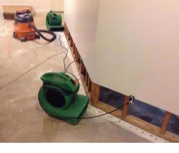 basement carpeting with SERVPRO air-mover 