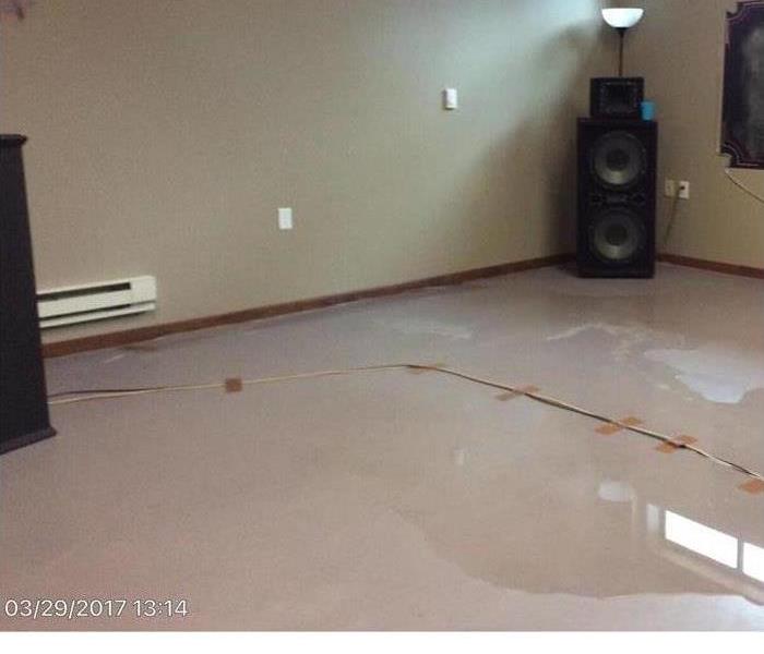 basement floor with sewage seeping through