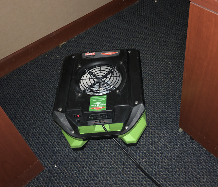 SERVPRO air mover drying out water damaged carpet